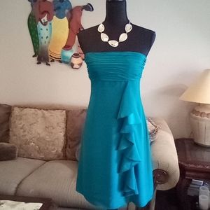 Dress. It is showing up blue on the pictures but It is green